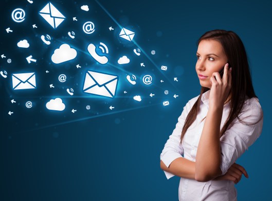 Young lady standing and making phone call with message icons